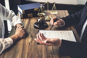 A Criminal Lawyer in East Peoria IL discussing a case with another lawyer