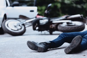 A man who has fallen off their motorcycle and needs an Auto Accident Lawyer in Peoria IL