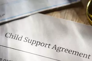 Part of a legal child support agreement is seen. Stephens Fiddes McGill provides child support and family law services.