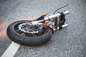 A piece of a motorcycle after a collision, where a Motorcycle Accident Lawyer in Pekin IL is needed