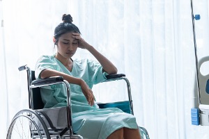 A woman in a wheelchair, suffering from Medical Malpractice in Peoria IL