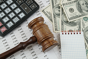Papers, money, a calculator and a gavel from a lawyer working on Social Security Law in Pekin IL