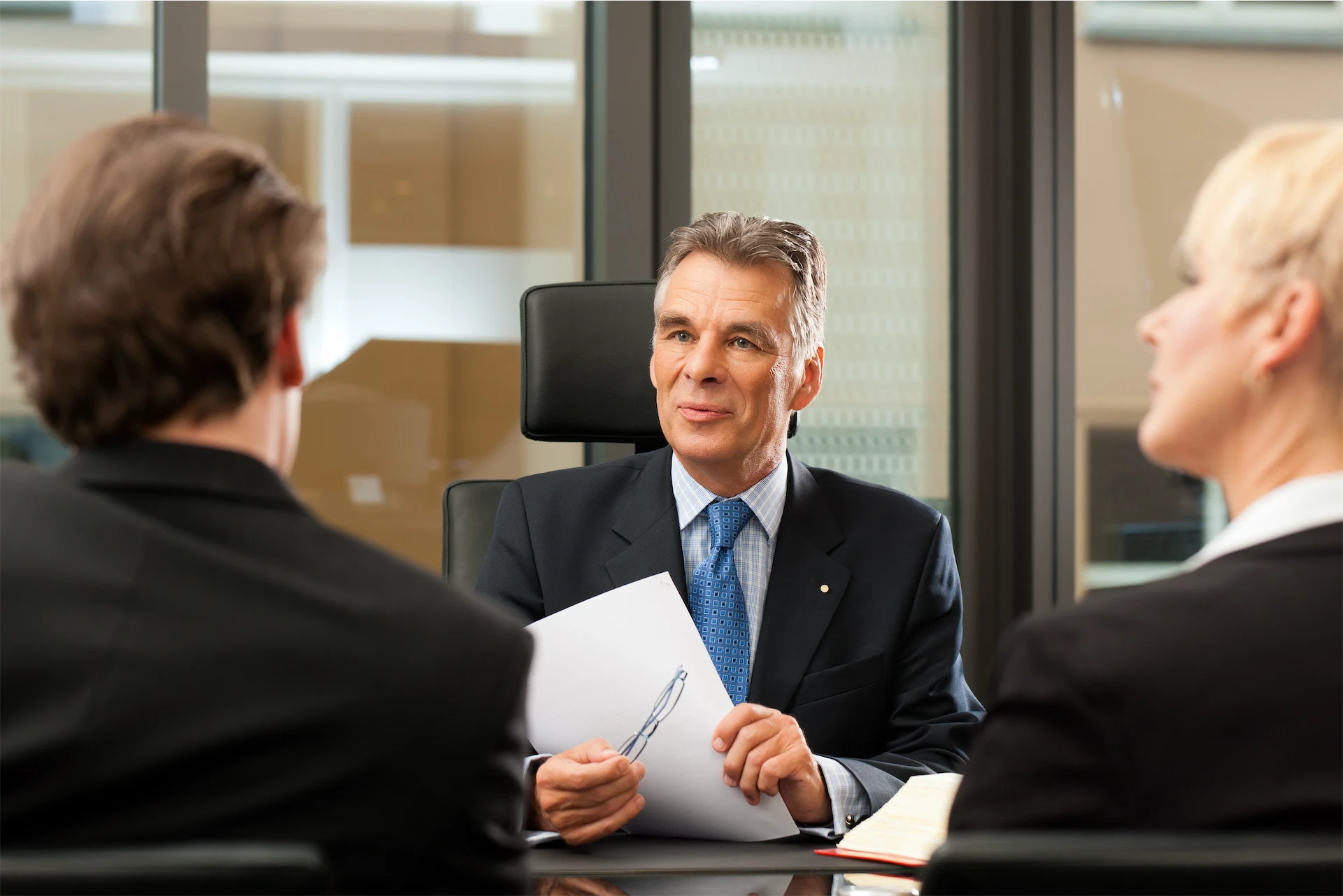 Image of attorney discussing Supplemental Security Income benefits with clients