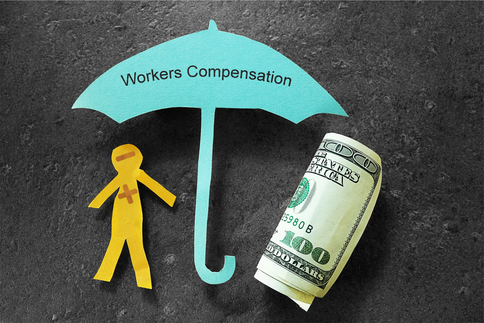 Image of Workers’ Compensation Lawyer concept with an injured worker, protective umbrella, and money representing workplace injury benefits